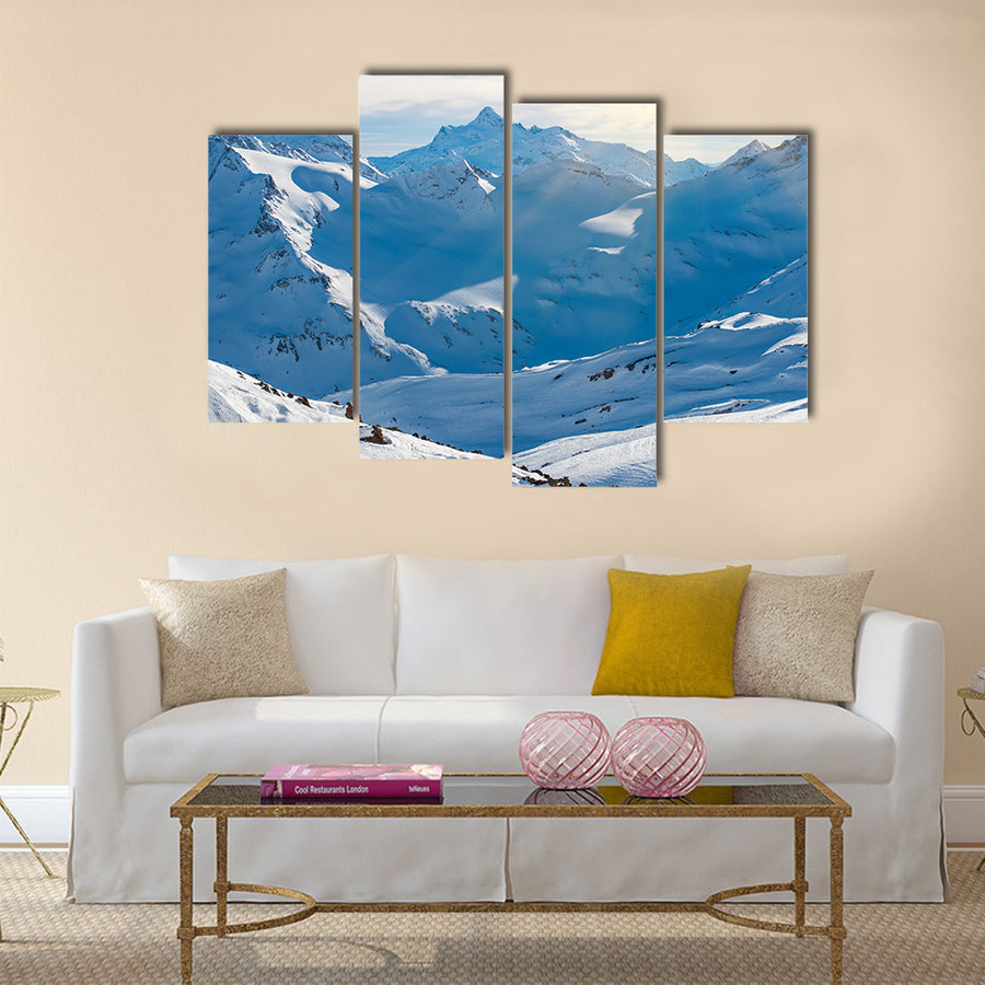 Snowy blue mountains in clouds Multi panel canvas wall art