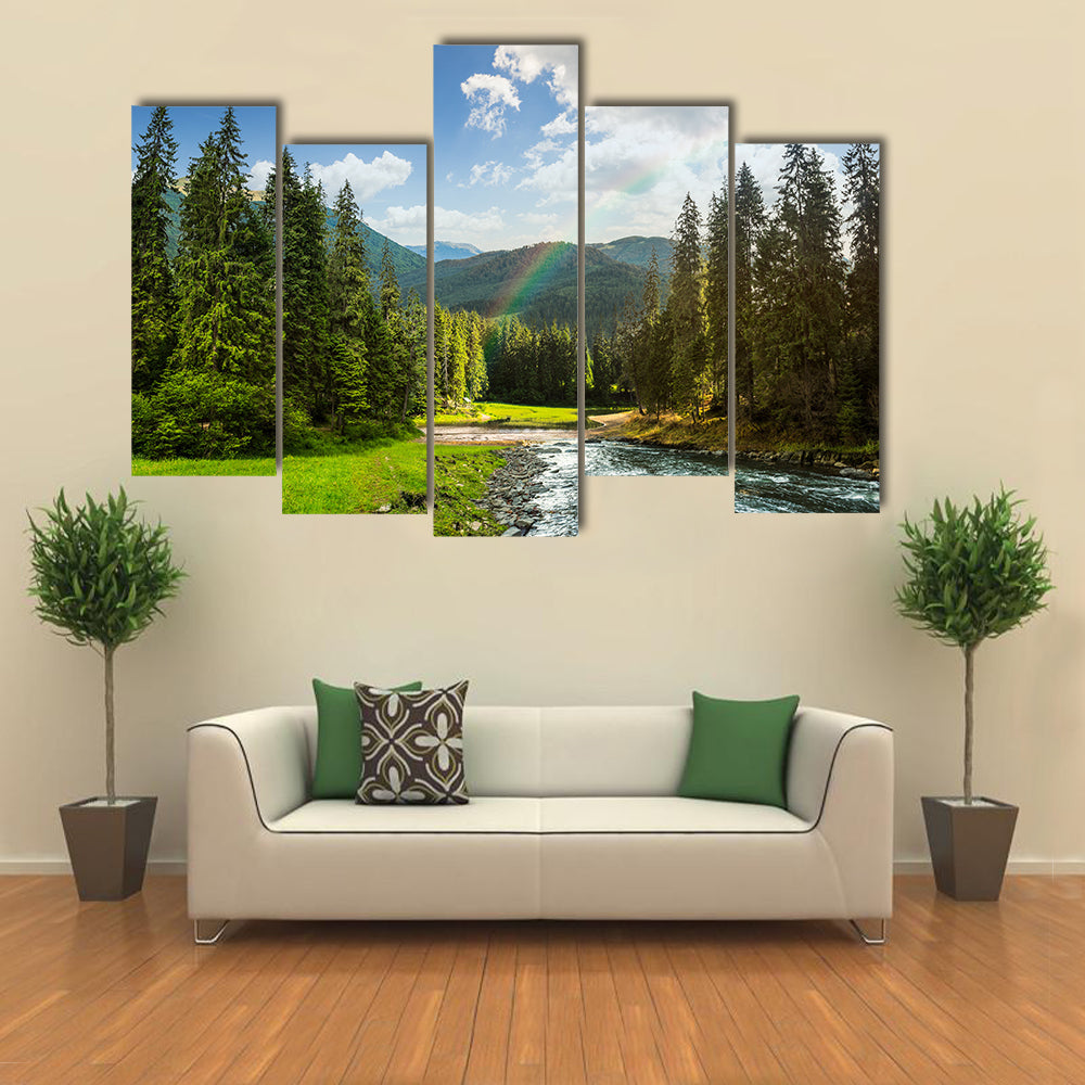 collage landscape with pine trees in mountains and a river in front flowing to lake in sunset light with rainbow multi panel canvas wall art