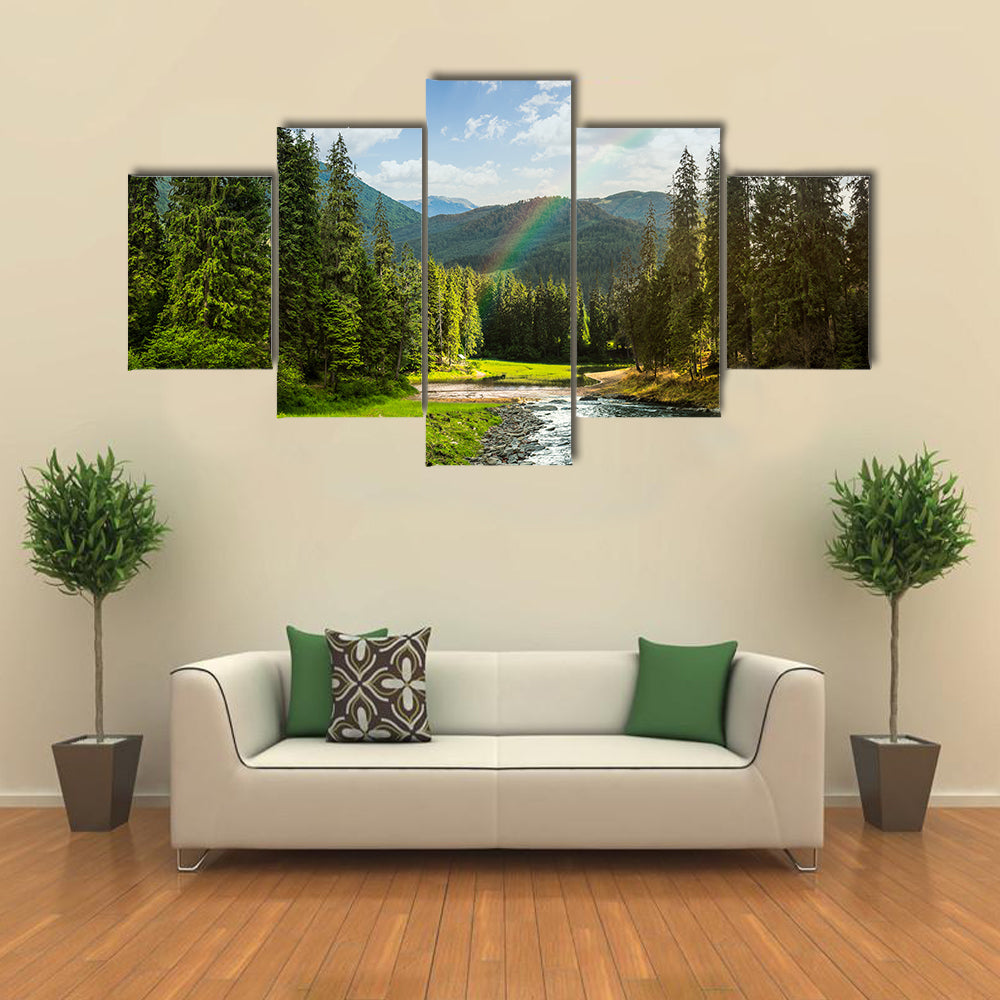 collage landscape with pine trees in mountains and a river in front flowing to lake in sunset light with rainbow multi panel canvas wall art