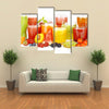 Glasses of tasty fresh juice, isolated on white Multi panel canvas wall art