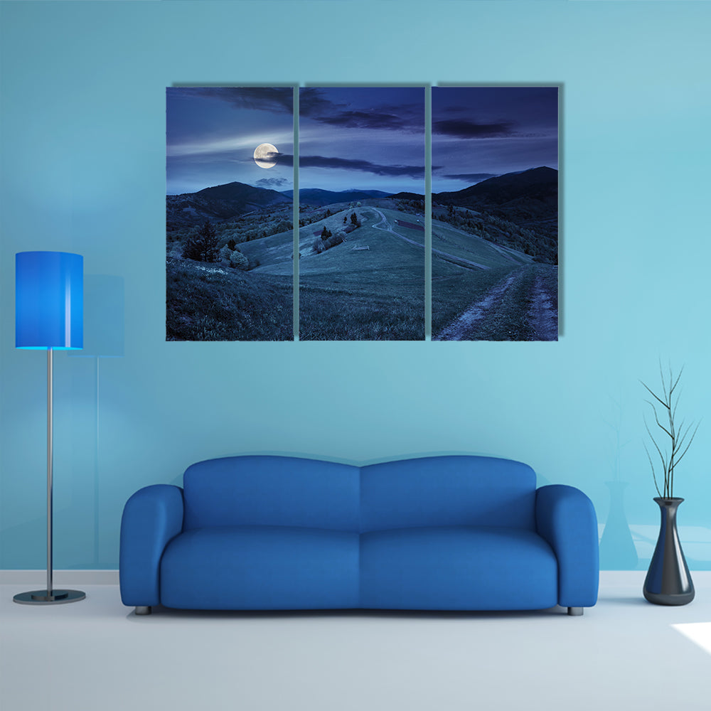 A Fence Near The Meadow Path On The Hillside And A Village Near A Forest Multi Panel Canvas Wall Art