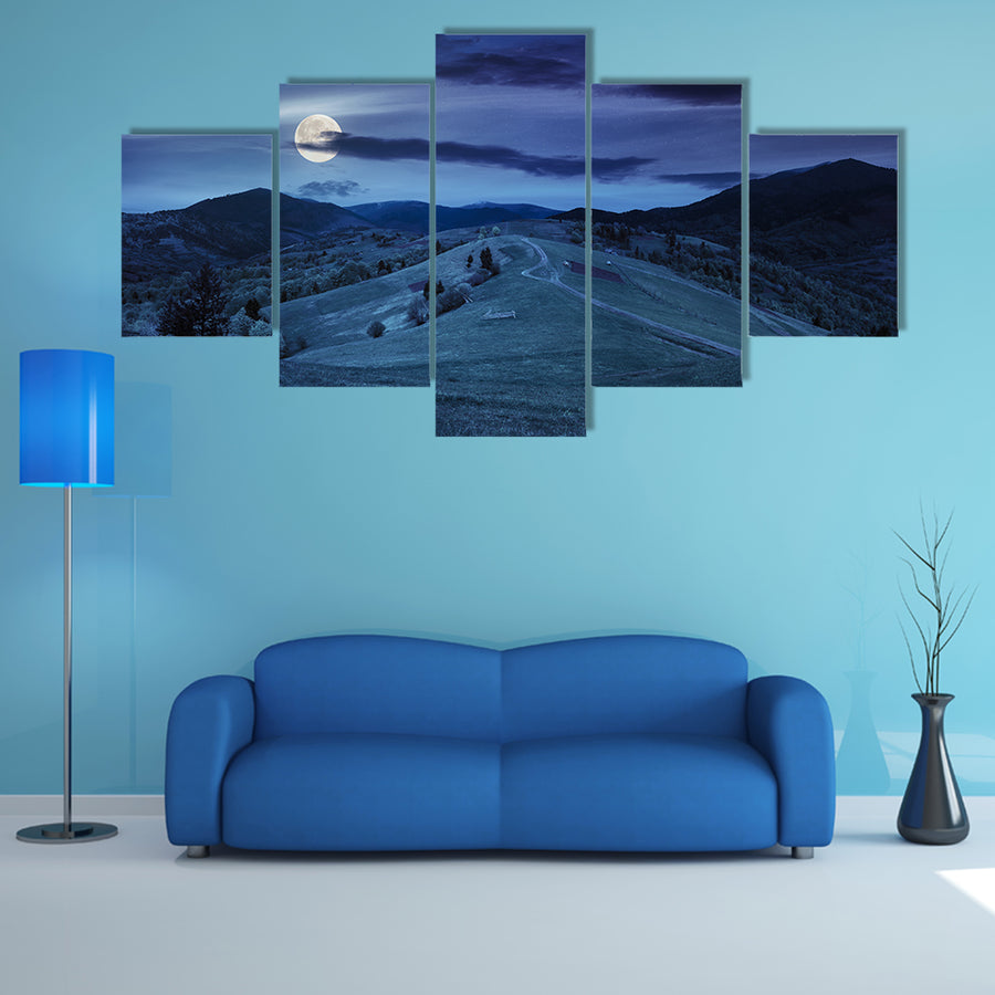 A Fence Near The Meadow Path On The Hillside And A Village Near A Forest Multi Panel Canvas Wall Art