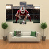 Football Player with a red uniform Multi panel canvas wall art