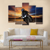 Young man riding big bike motorcycle people adventure sport leisure theme Multi panel canvas wall art