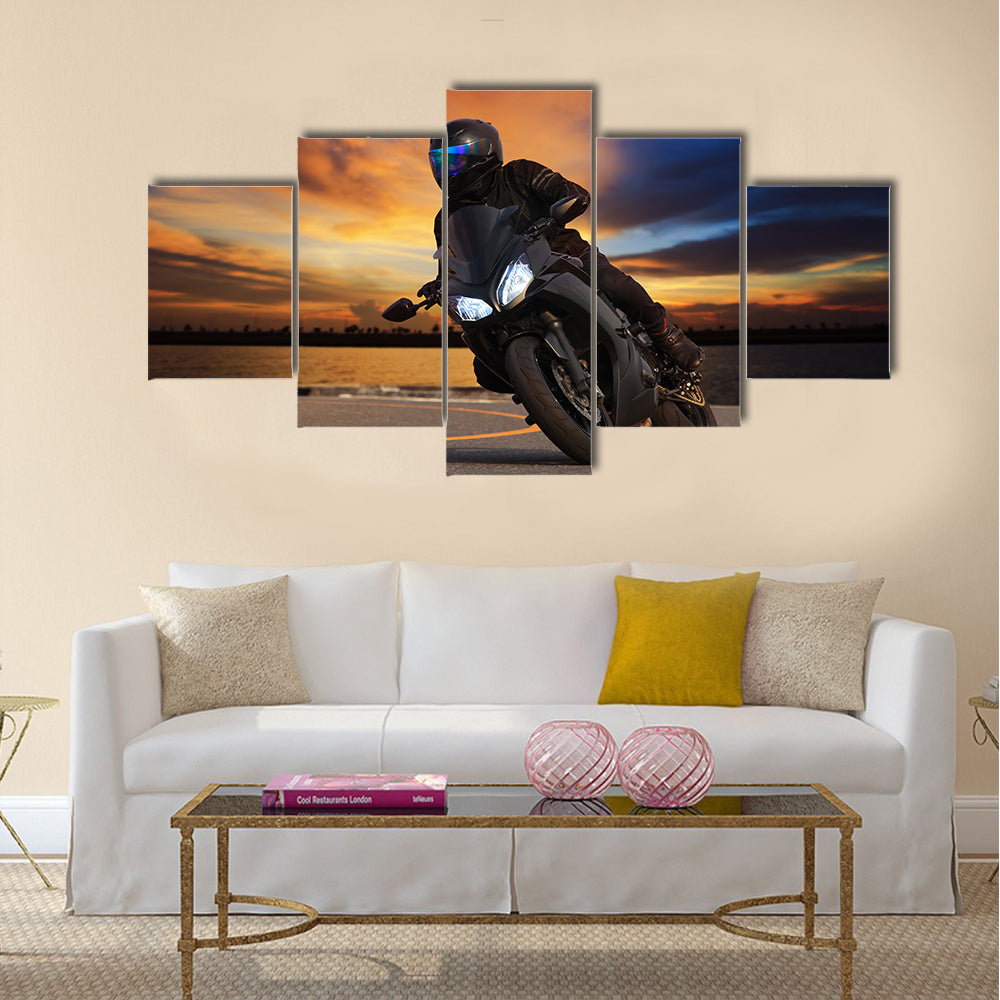 Young man riding big bike motorcycle people adventure sport leisure theme Multi panel canvas wall art