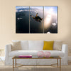 Portrait Of Two Tandem Skydivers In Action Parachuting Through The Air Multi Panel Canvas Wall Art