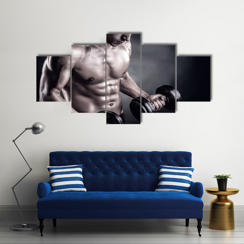 Close up of a muscular young man lifting weights on dark background, Multi panel canvas wall art