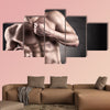 Healthy muscular young man on a dark background Multi panel canvas wall art