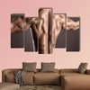 strong athletic man back on a gray background Multi panel canvas wall art