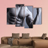 Portrait of man with muscular arms Multi panel canvas wall art