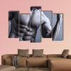 Portrait of man with muscular arms Multi panel canvas wall art