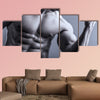 Portrait of man with muscular arms Multi panel canvas wall art