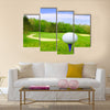 Golf ball on course with beautiful blurry landscape Multi Panel Canvas Wall Art