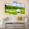 Golf ball on course with beautiful blurry landscape Multi Panel Canvas Wall Art