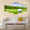 Golf ball on course with beautiful blurry landscape Multi Panel Canvas Wall Art