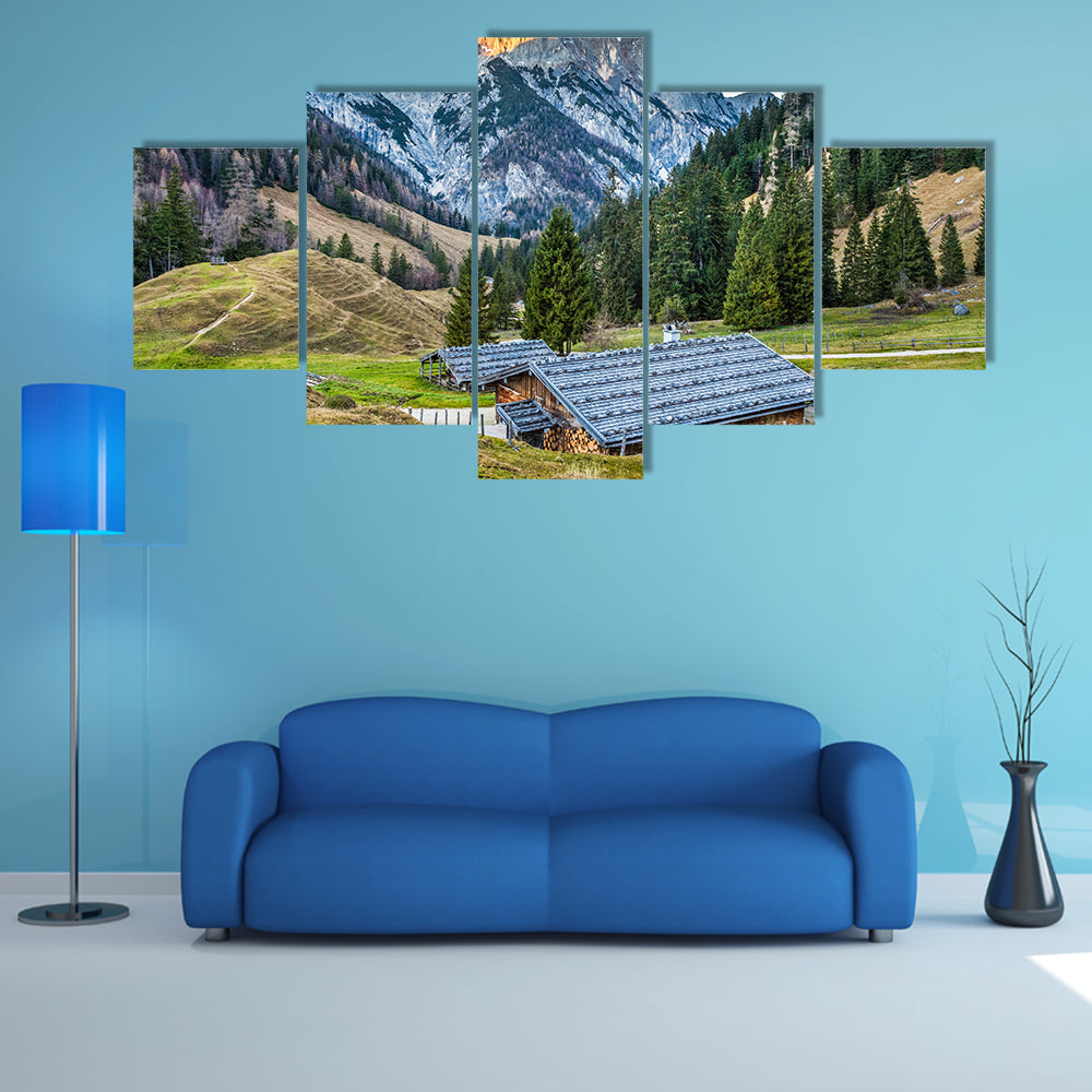 Beautiful landscape in the Alps with traditional mountain chalets multi panel canvas wall art
