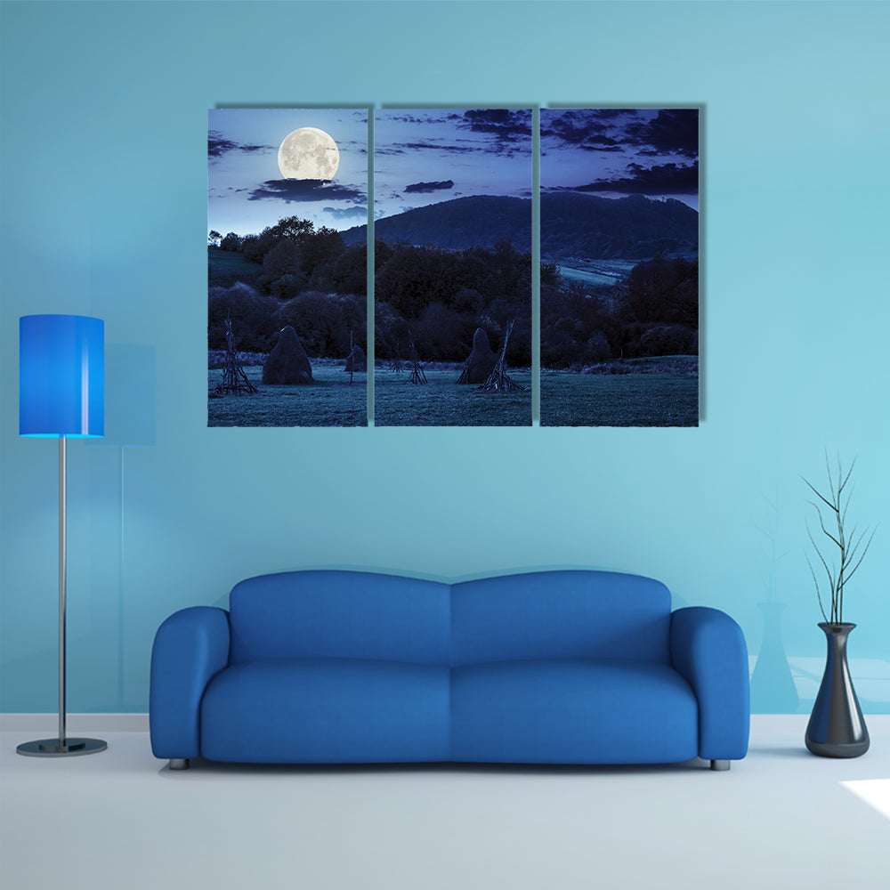 The Composite Agriculture Landscape With Stack Of Hay On A Green Meadow Near Forest Multi Panel Canvas Wall Art