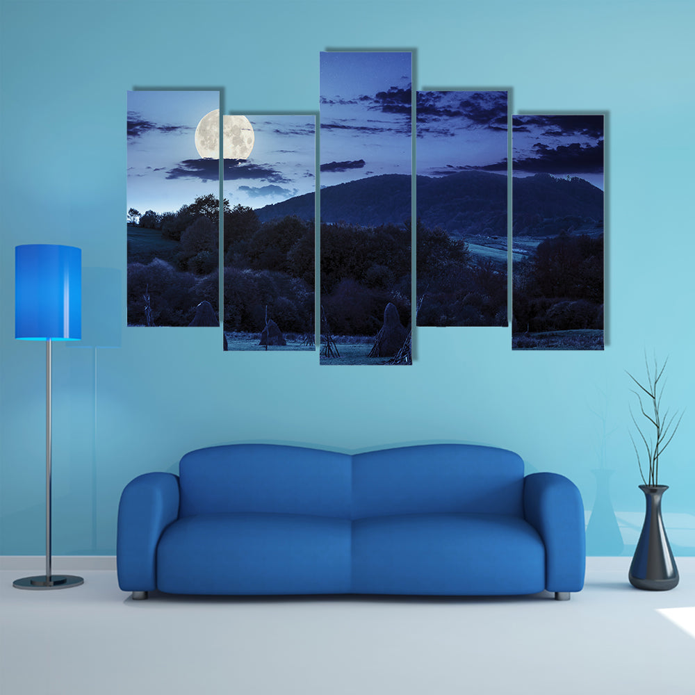 The Composite Agriculture Landscape With Stack Of Hay On A Green Meadow Near Forest Multi Panel Canvas Wall Art