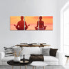 Meditation yoga couple meditating at serene beach sunset panoramic canvas wall art