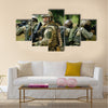 Team of soldiers engaged in the exploration of the forest Multi Panel Canvas Wall Art