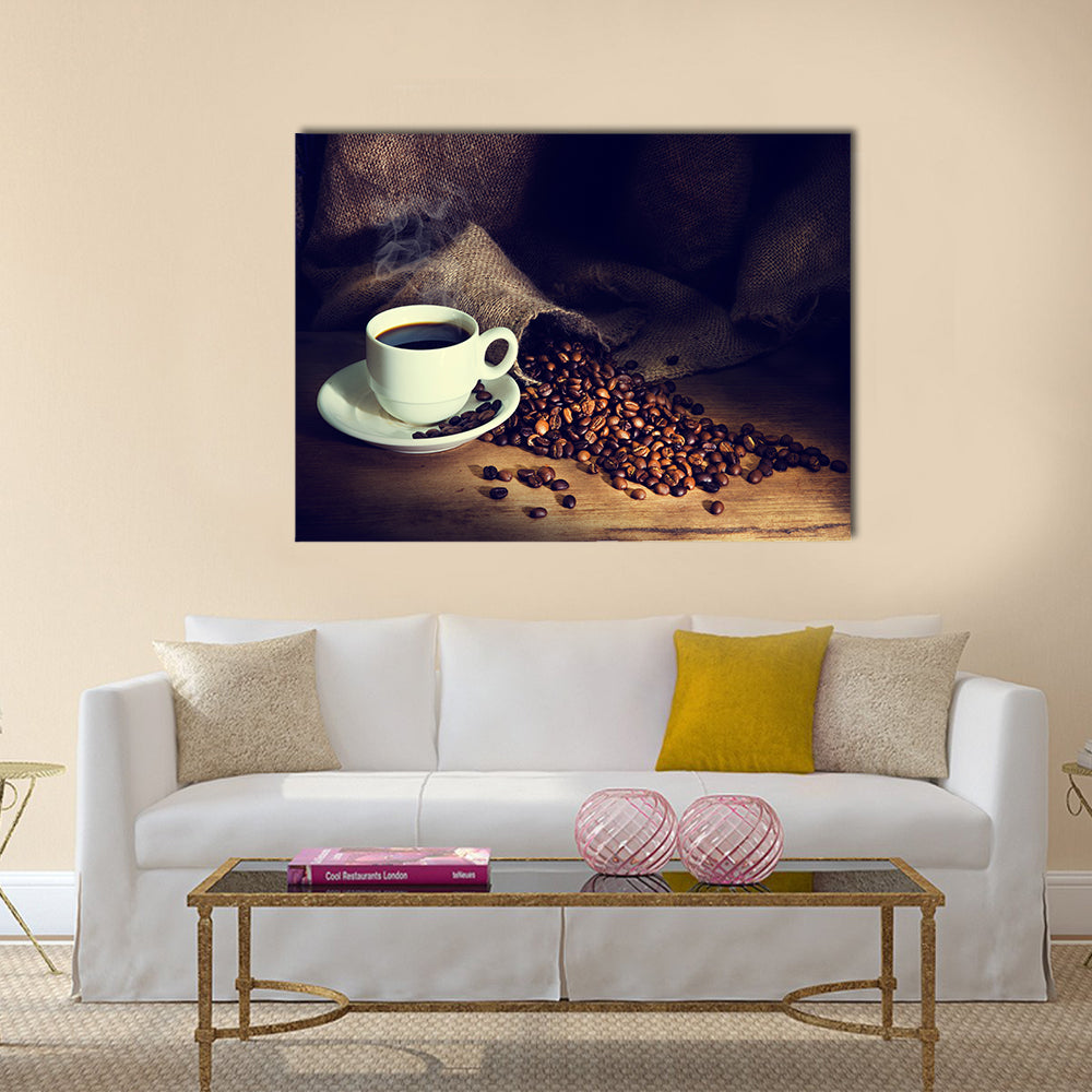 Coffee cup and coffee beans on a wooden table Multi Panel Canvas Wall Art