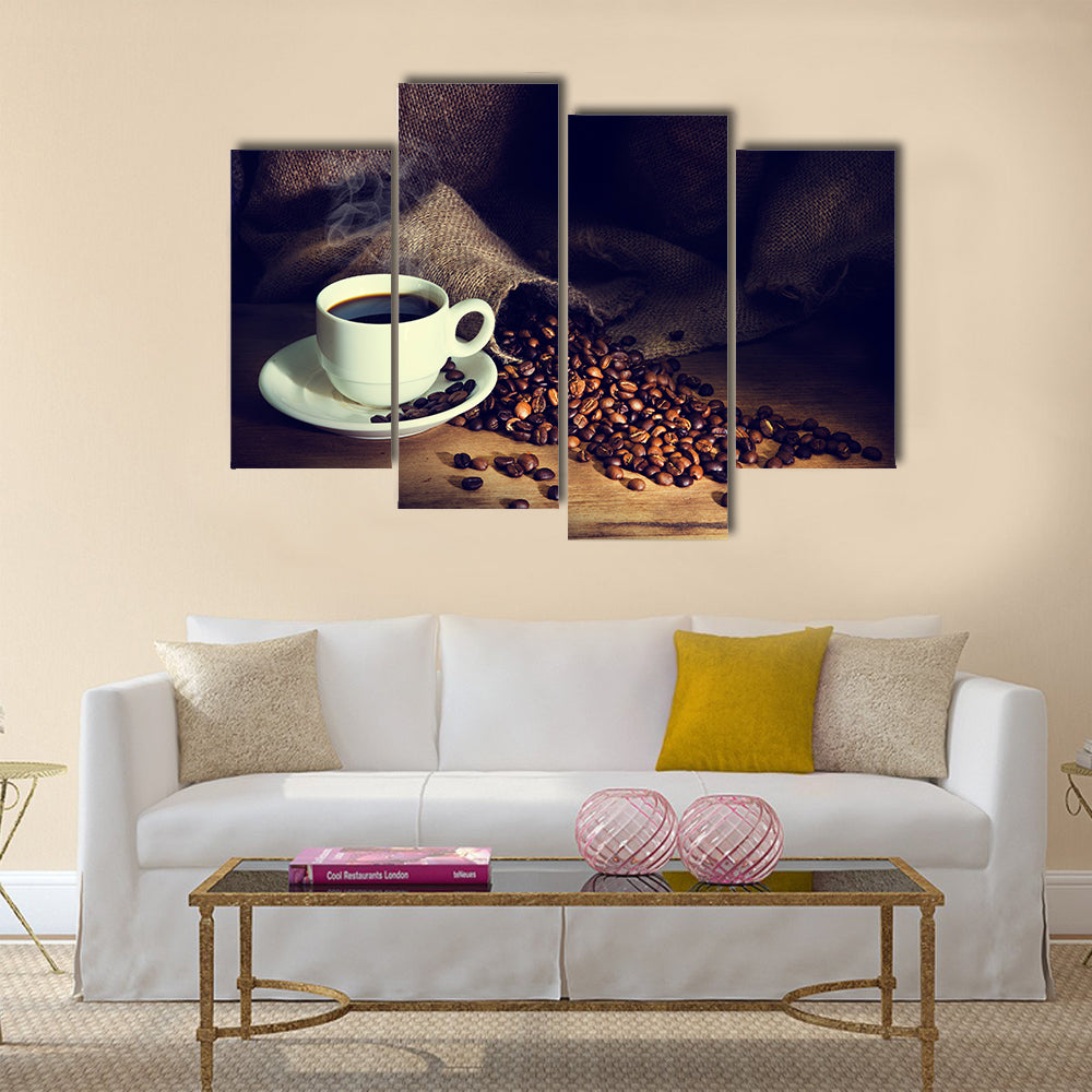 Coffee cup and coffee beans on a wooden table Multi Panel Canvas Wall Art