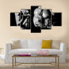 Bodybuilding, Strong man and a woman posing on a black background, Multi panel canvas wall art