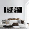 Bodybuilding. Strong man and a woman posing panoramic canvas wall art