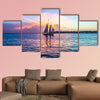 Sunset at Key West with sailing boat and bright sky multi panel canvas wall art