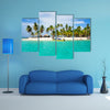 Tourist arriving beautiful beach with crystal clear turquoise water multi panel canvas wall art