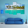 Tourist arriving beautiful beach with crystal clear turquoise water multi panel canvas wall art