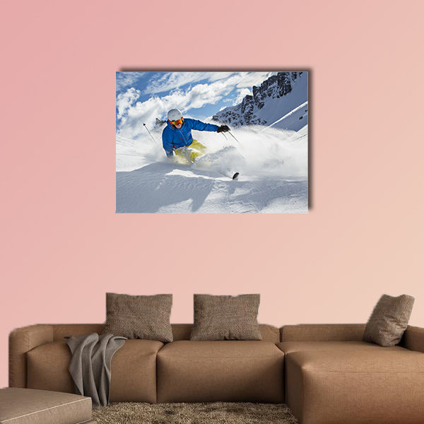 Skier skiing downhill in high mountains during sunny day Multi panel canvas wall art