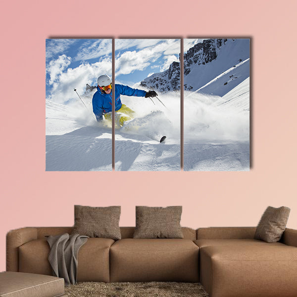 Skier skiing downhill in high mountains during sunny day Multi panel canvas wall art