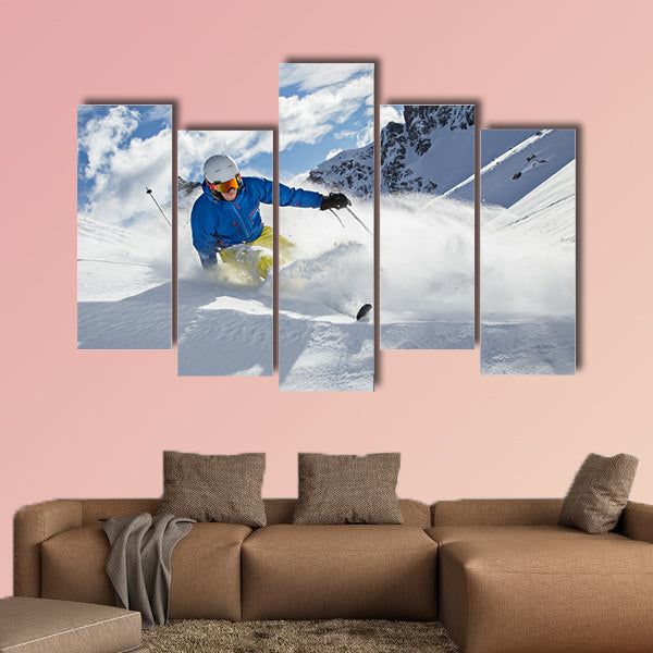 Skier skiing downhill in high mountains during sunny day Multi panel canvas wall art
