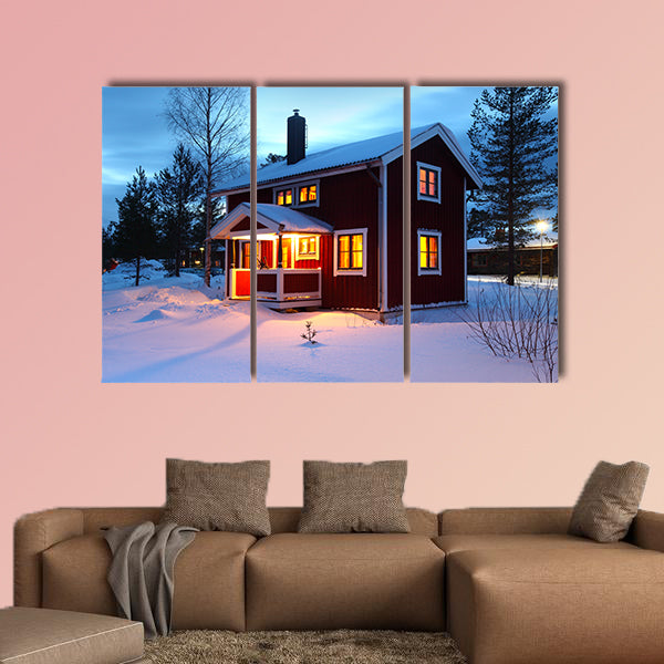Wooden house in Sweden during winter by night