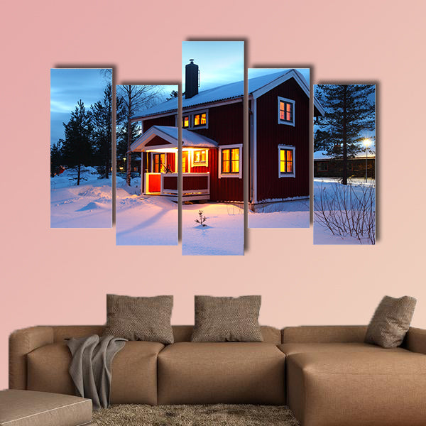 Wooden house in Sweden during winter by night