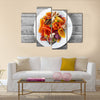 Basket of fresh organic fruit and vegetables in garden Multi panel canvas wall art