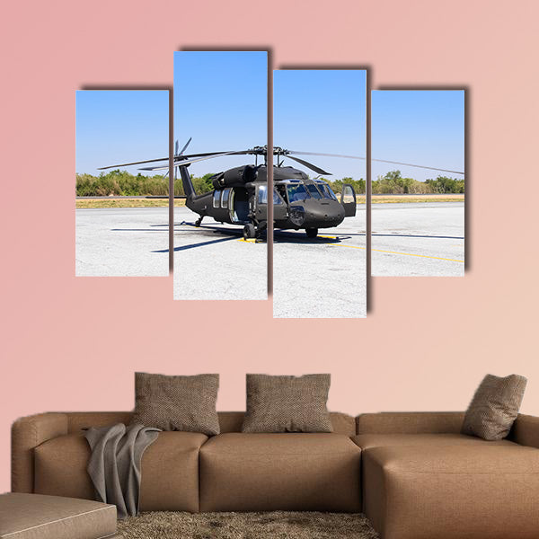 Military helicopter Blackhawk at a base multi panel canvas wall