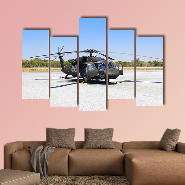 Military helicopter Blackhawk at a base multi panel canvas wall