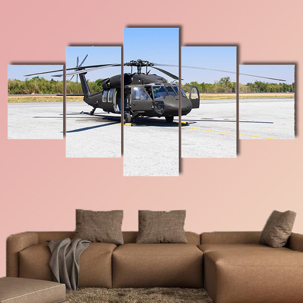 Military helicopter Blackhawk at a base multi panel canvas wall
