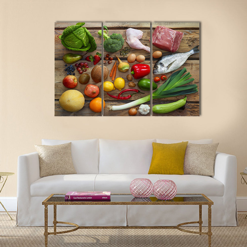 Various Paleo diet products on wooden table, top view Multi panel canvas wall art
