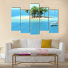 Snorkeling in shallow tropical water multi panel canvas wall art