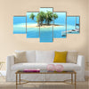 Snorkeling in shallow tropical water multi panel canvas wall art