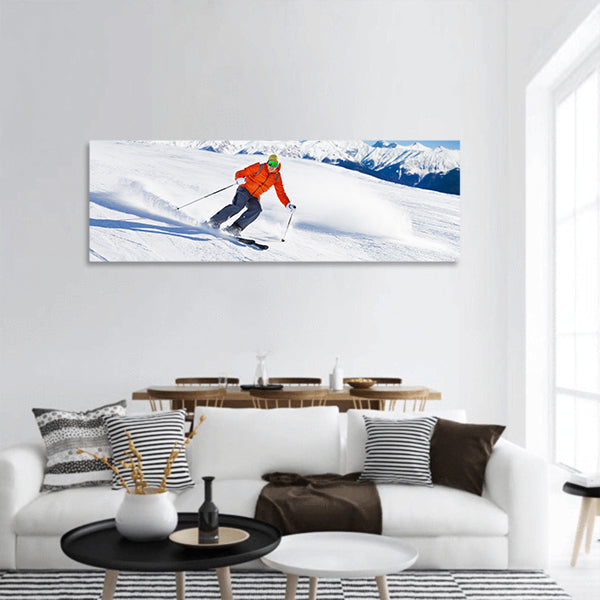 Skier in mask slides fast while skiing from slope panoramic canvas wall art