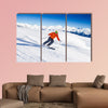 Skier in mask slides fast while skiing from slope Multi panel canvas wall art