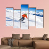 Skier in mask slides fast while skiing from slope Multi panel canvas wall art