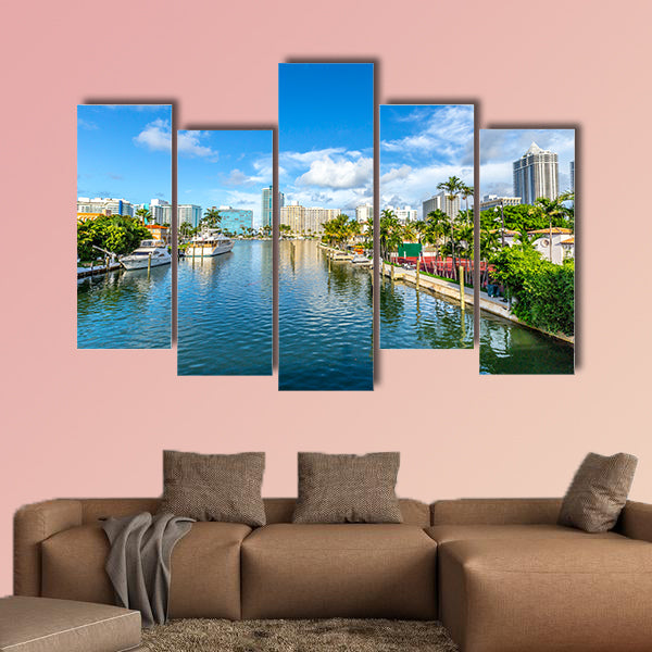 Luxury houses at the canal in Miami Beach with boats Multi panel canvas wall art