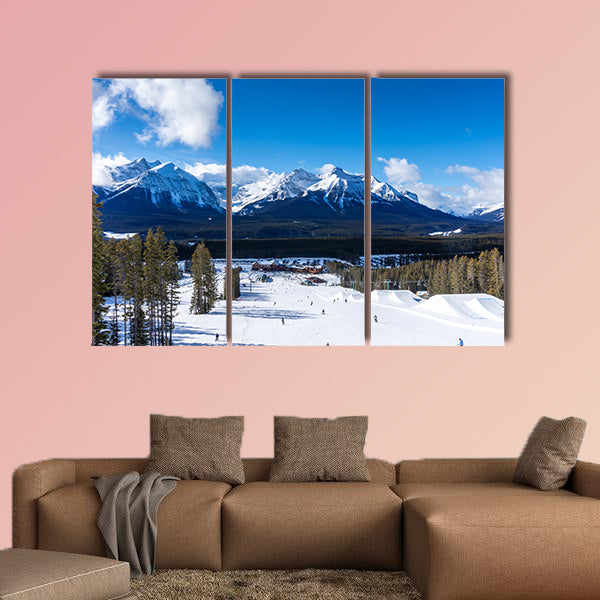 Skiers and snowboarders descend the slopes toward Lake wall art