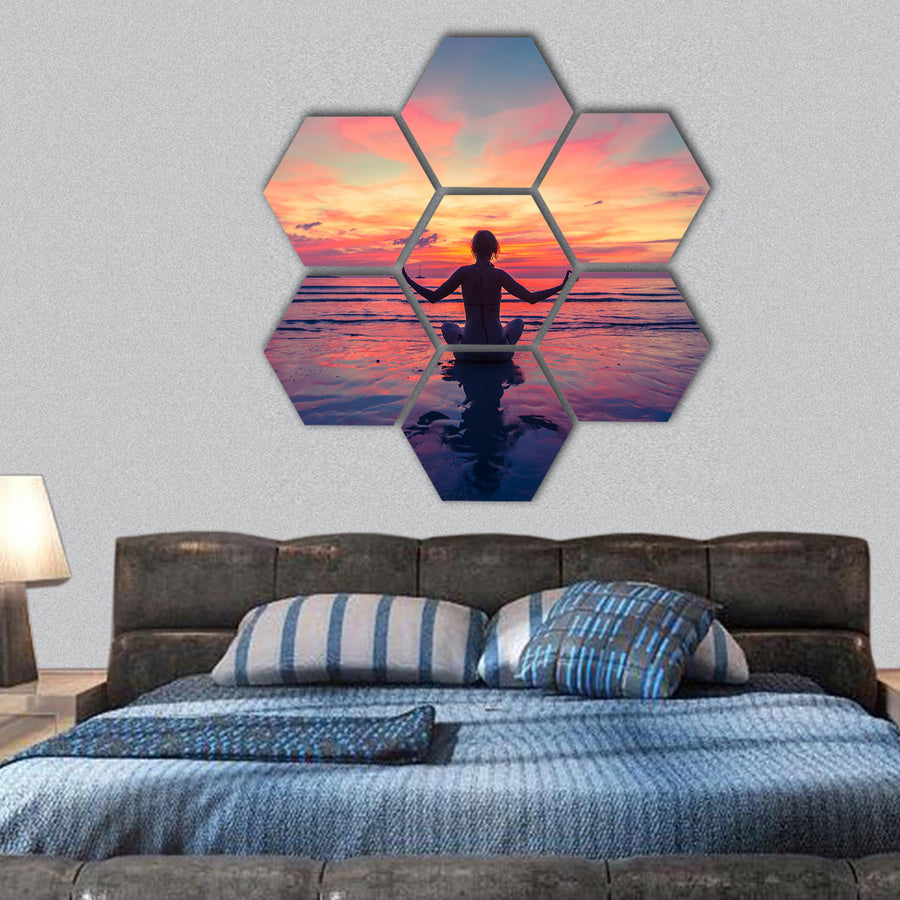 Woman doing meditation near the ocean beach hexagonal canvas wall art