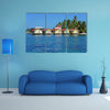 Tropical cabins over water of the Caribbean Sea, multi panel canvas wall art